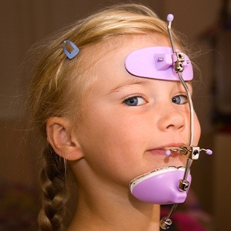 Young girl with head gear