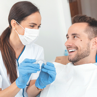 Patient and orthodontist talking about Invisalign