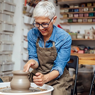 Woman smiling during pottery class