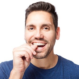 Man placing Invisalign tray