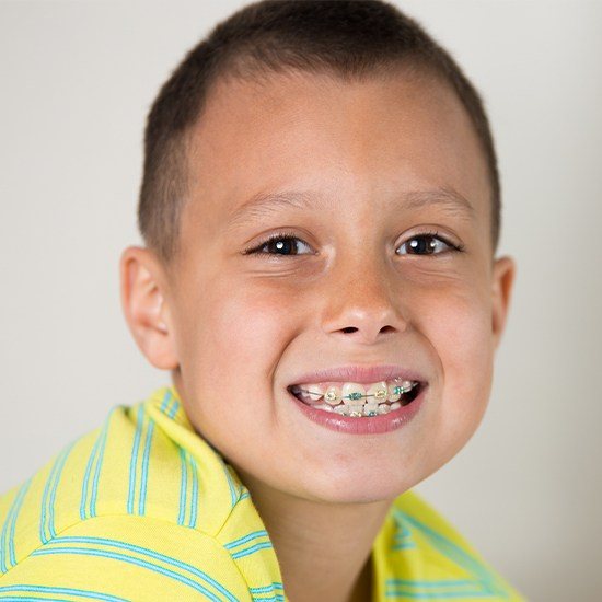 Smiling preteen boy with braces