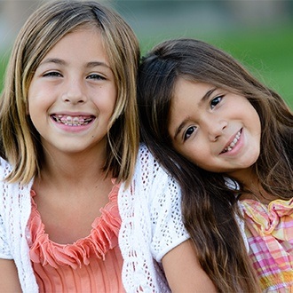 Young girl with braces smiling