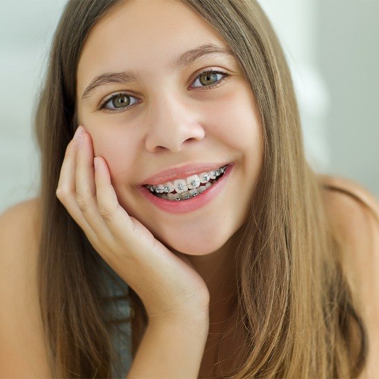 Smiling teen girl with self ligating braces
