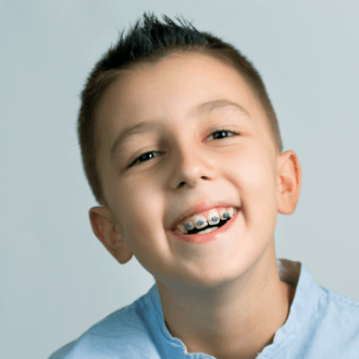 Smiling preteen boy with braces