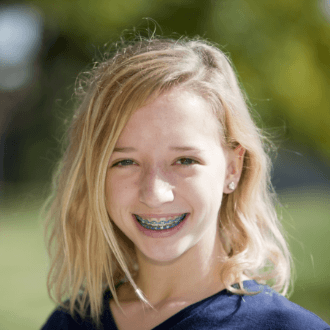 Teen girl with braces smiling